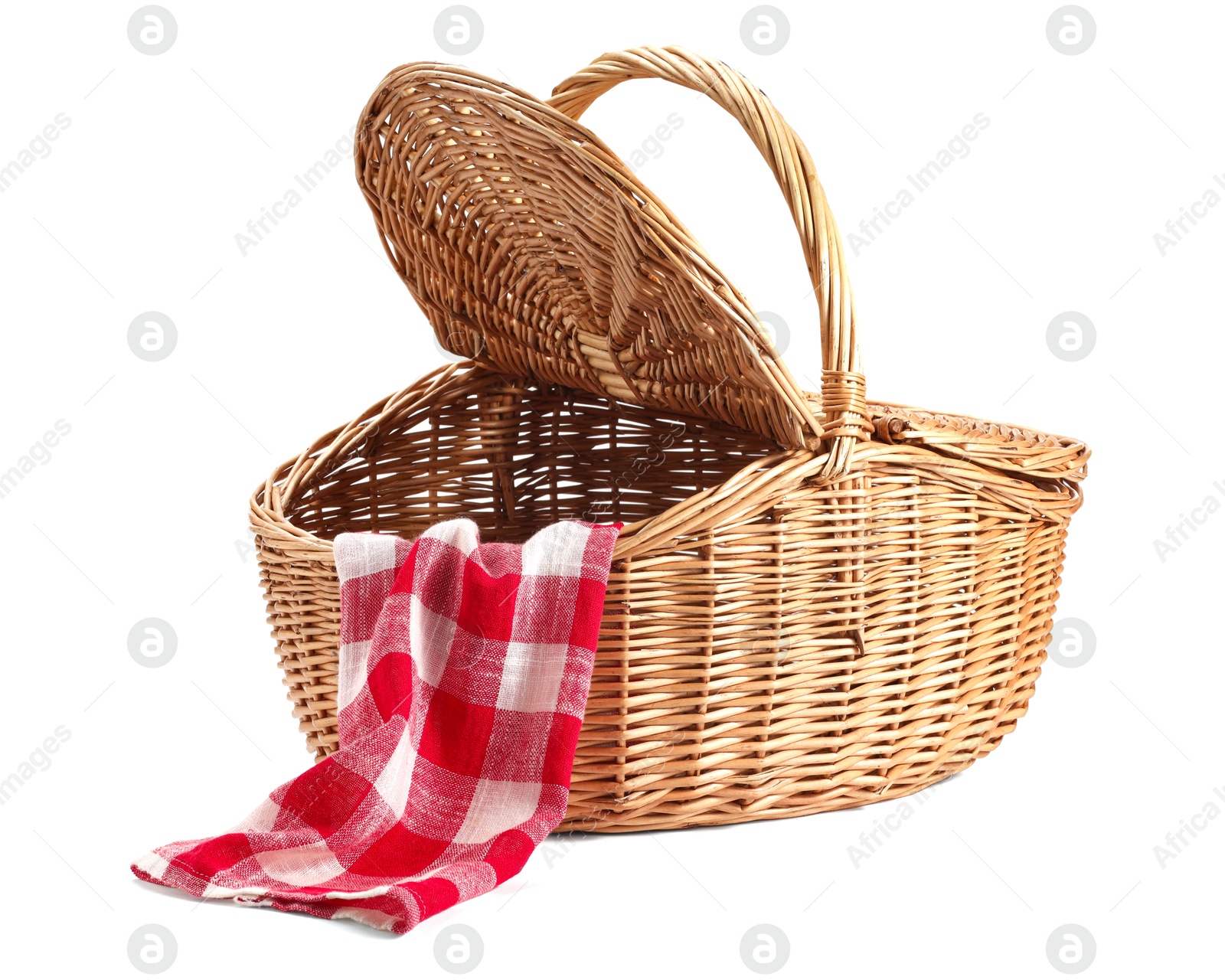 Photo of One open picnic wicker basket with checkered napkin isolated on white