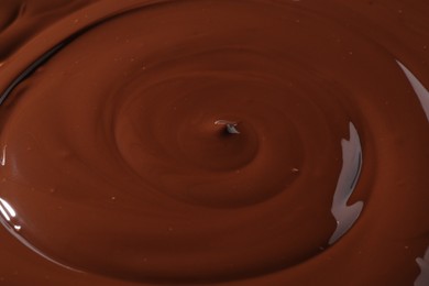 Tasty melted chocolate as background, closeup view