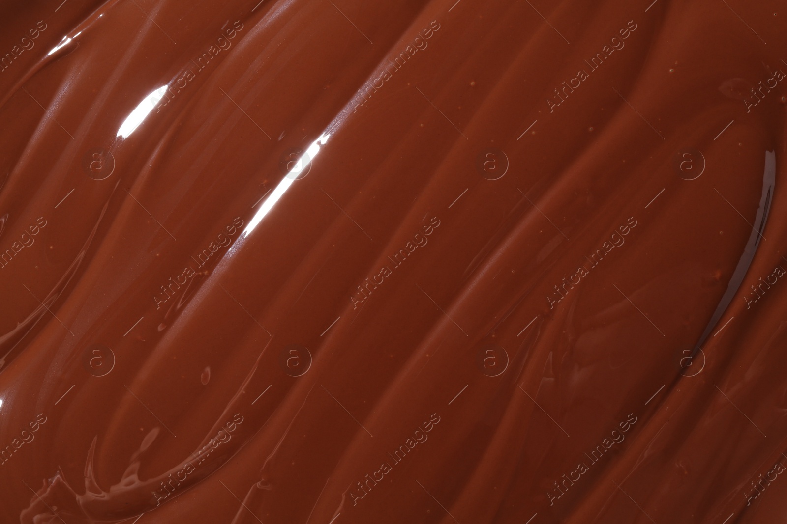 Photo of Tasty melted chocolate as background, top view