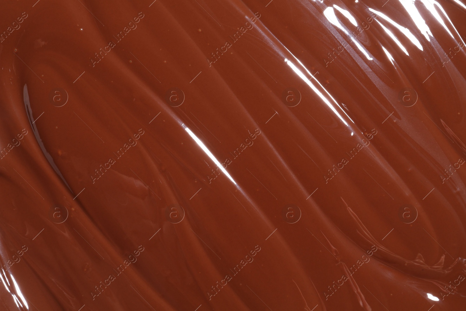 Photo of Tasty melted chocolate as background, top view