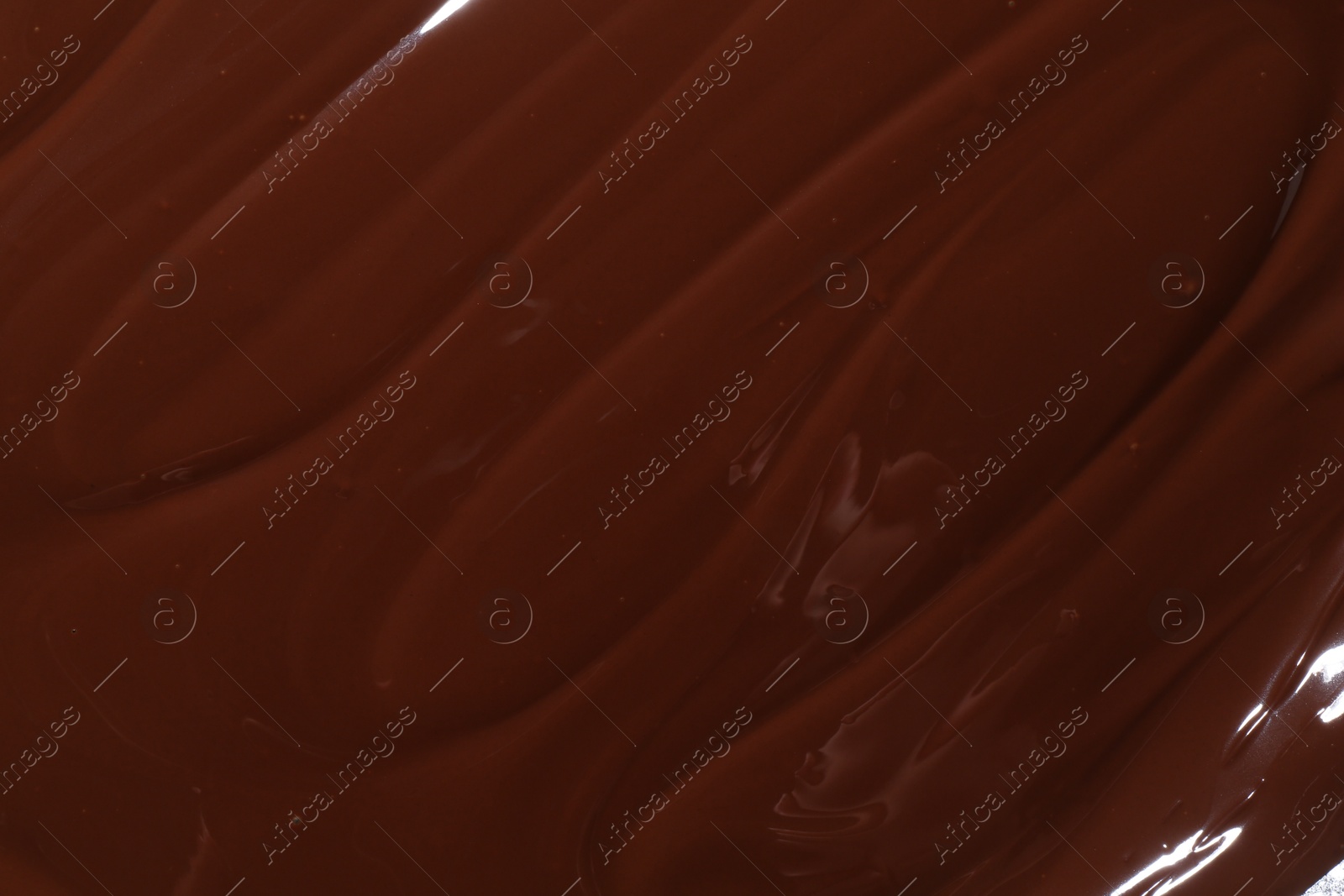 Photo of Tasty melted chocolate as background, top view