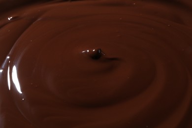 Tasty melted chocolate as background, closeup view