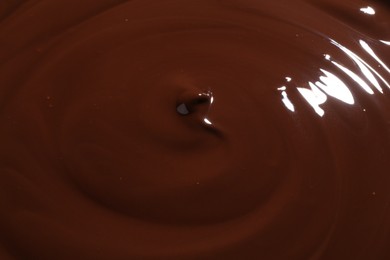 Tasty melted chocolate as background, closeup view