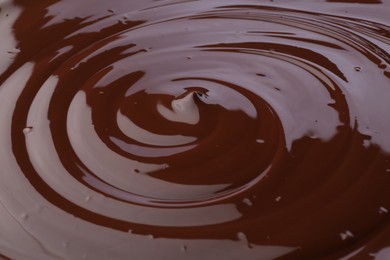 Tasty melted chocolate as background, closeup view