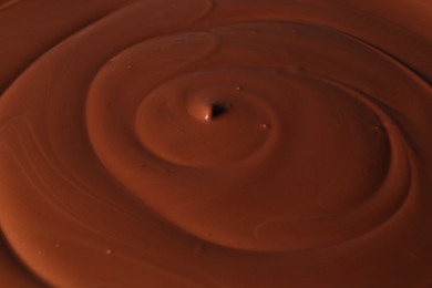 Tasty melted chocolate as background, closeup view