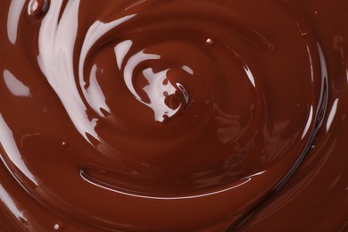 Photo of Delicious melted chocolate as background, top view