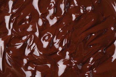 Photo of Delicious melted chocolate as background, top view