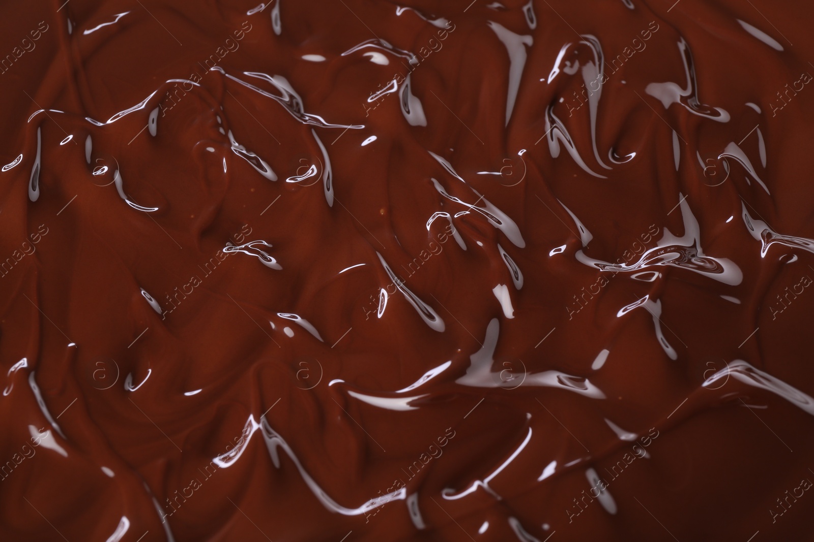 Photo of Delicious melted chocolate as background, top view