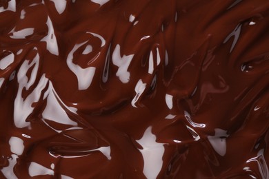 Photo of Delicious melted chocolate as background, top view