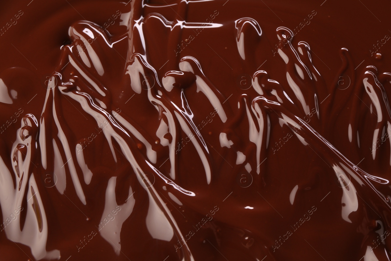 Photo of Delicious melted chocolate as background, top view