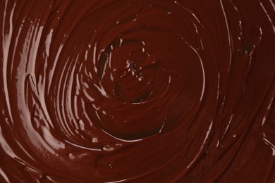 Photo of Delicious melted chocolate as background, top view