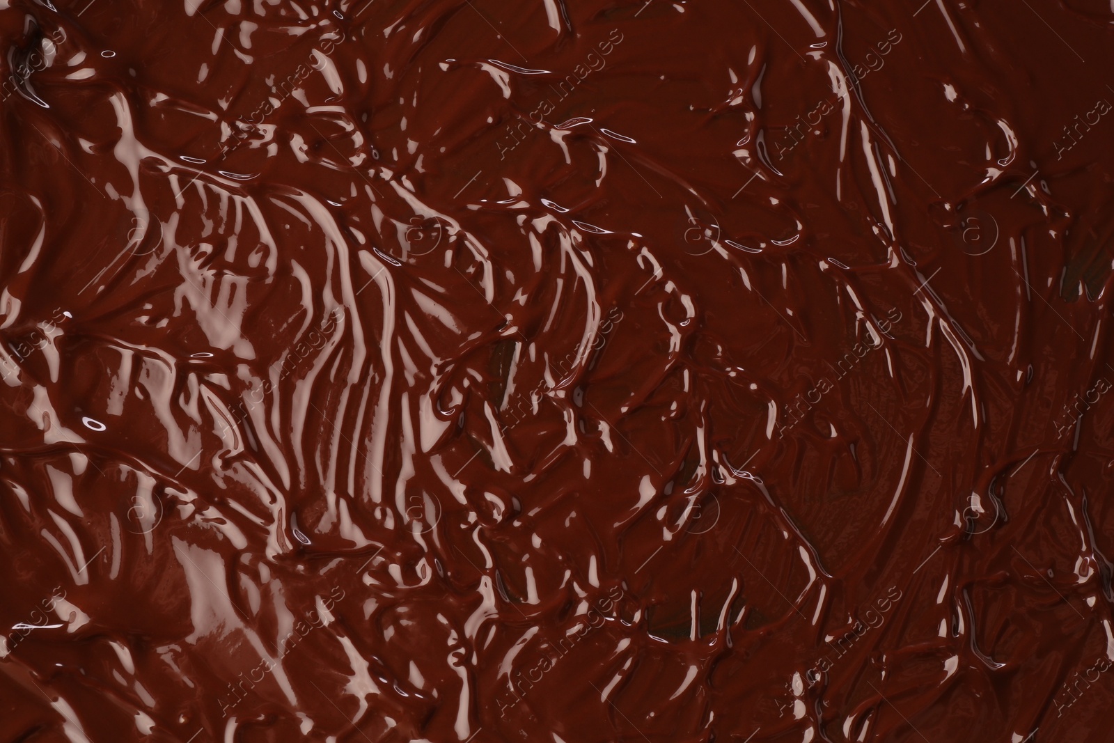 Photo of Delicious melted chocolate as background, top view