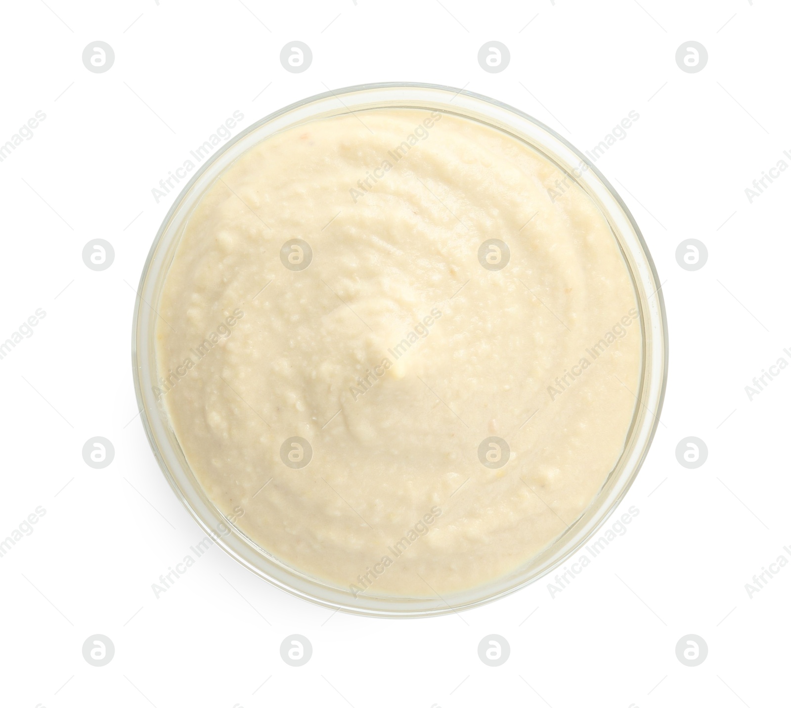 Photo of Delicious hummus in bowl isolated on white, top view