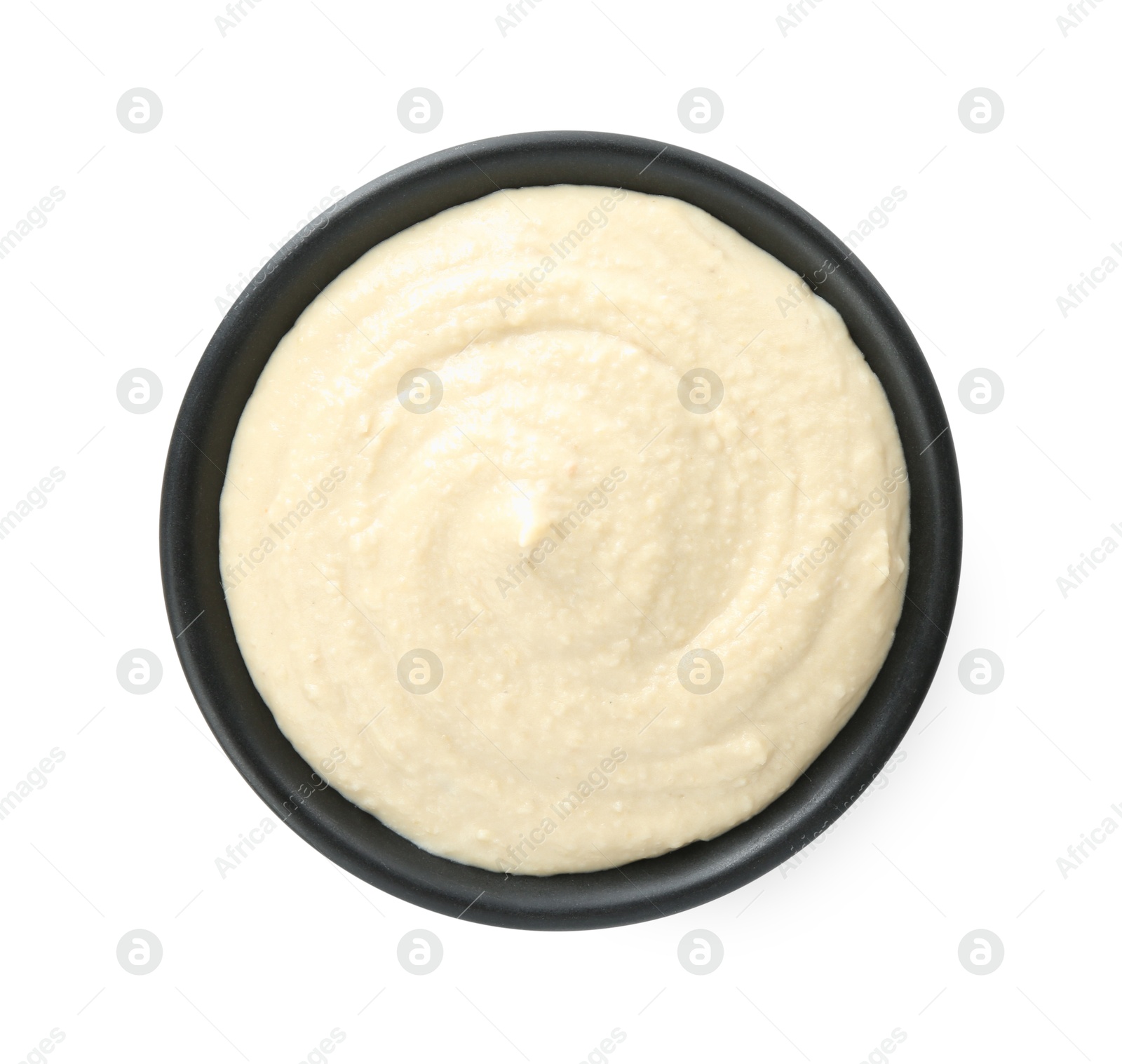 Photo of Delicious hummus in bowl isolated on white, top view