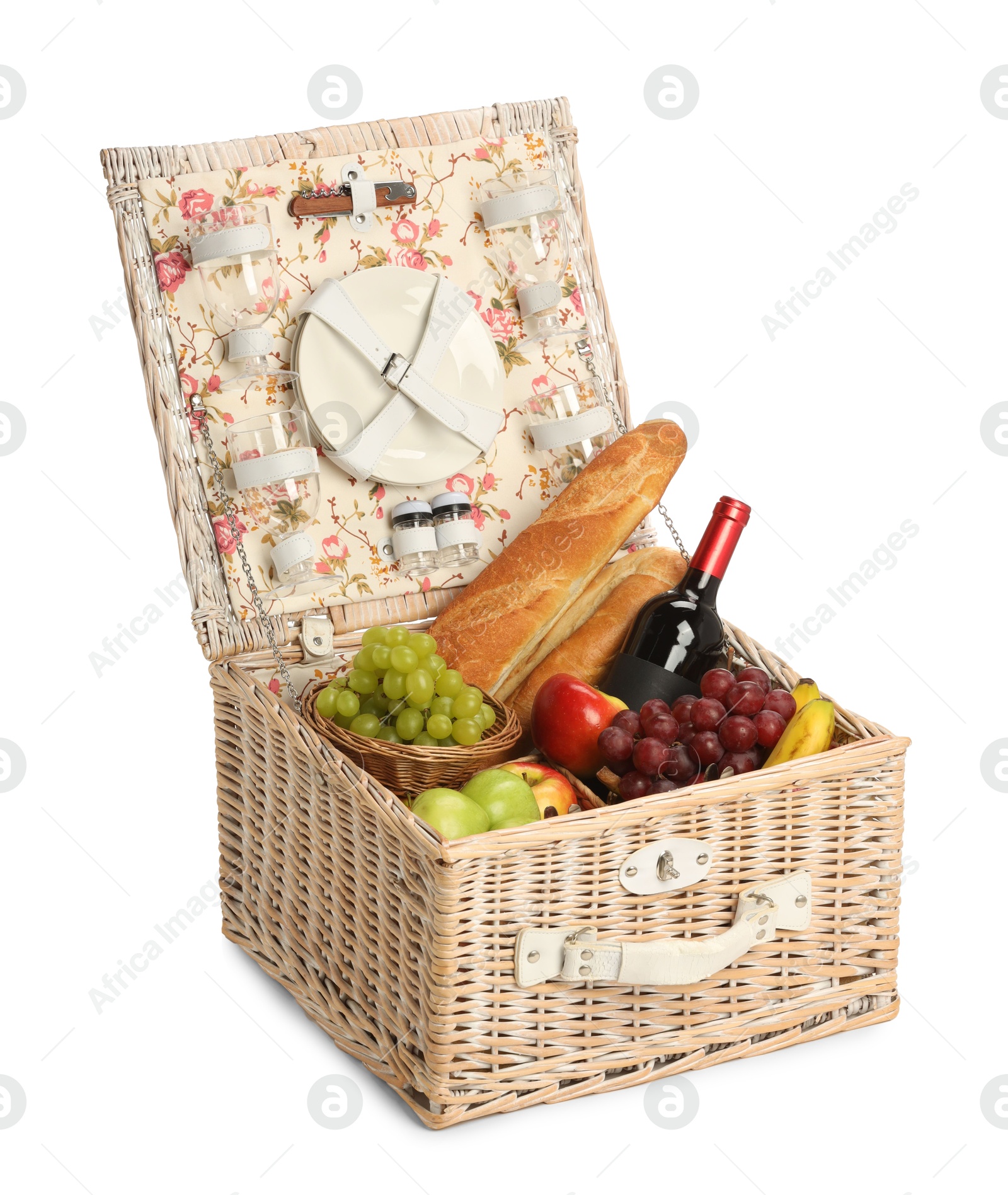 Photo of Picnic basket with tableware, food and wine isolated on white