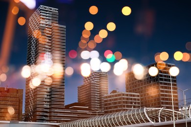 Image of City with buildings and blurred lights, double exposure