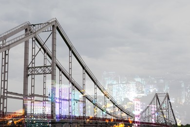 Image of Double exposure with bridge and night city