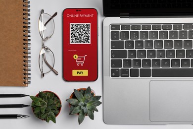 Online payment system. Smartphone with open application on table, top view