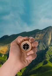 Image of Man using compass in mountains, closeup. Navigational instrument