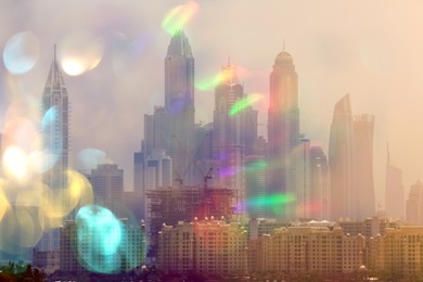 City with buildings and blurred lights, double exposure