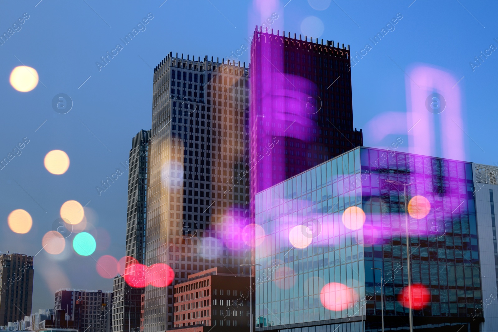 Image of City with buildings and blurred lights, double exposure