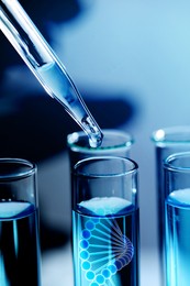 Dripping sample from dropper into test tube with illustration of DNA in laboratory, closeup