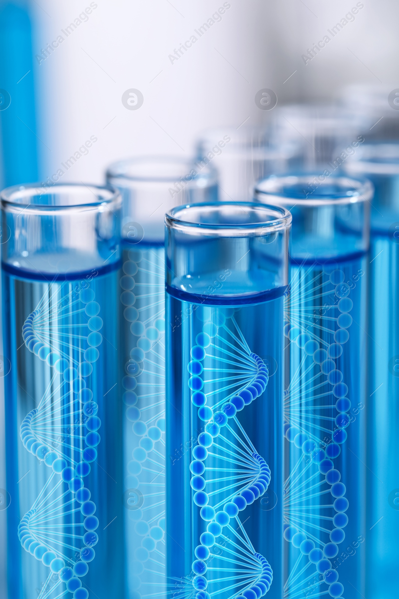 Image of Test tubes with illustrations of DNA in laboratory, closeup