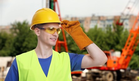 Image of Young man wearing safety equipment at construction site. Banner design