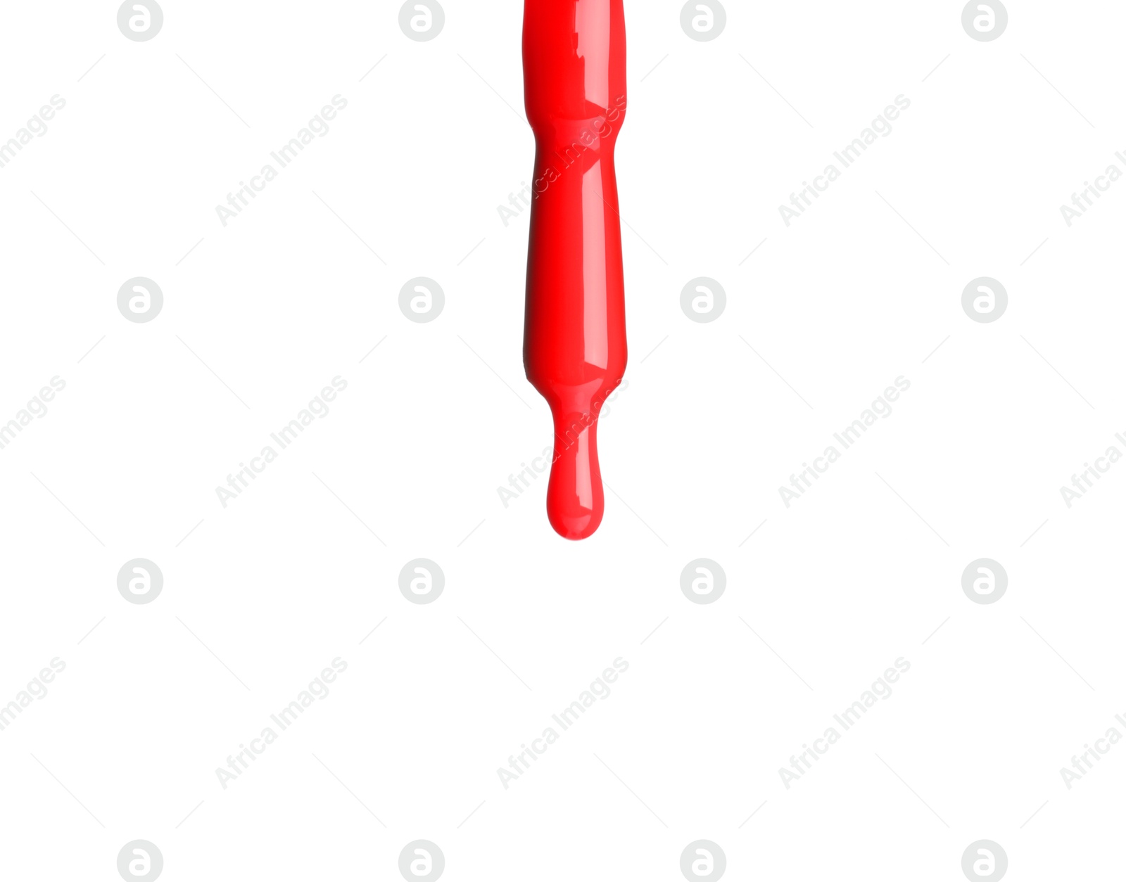 Photo of Red nail polish dripping from brush isolated on white