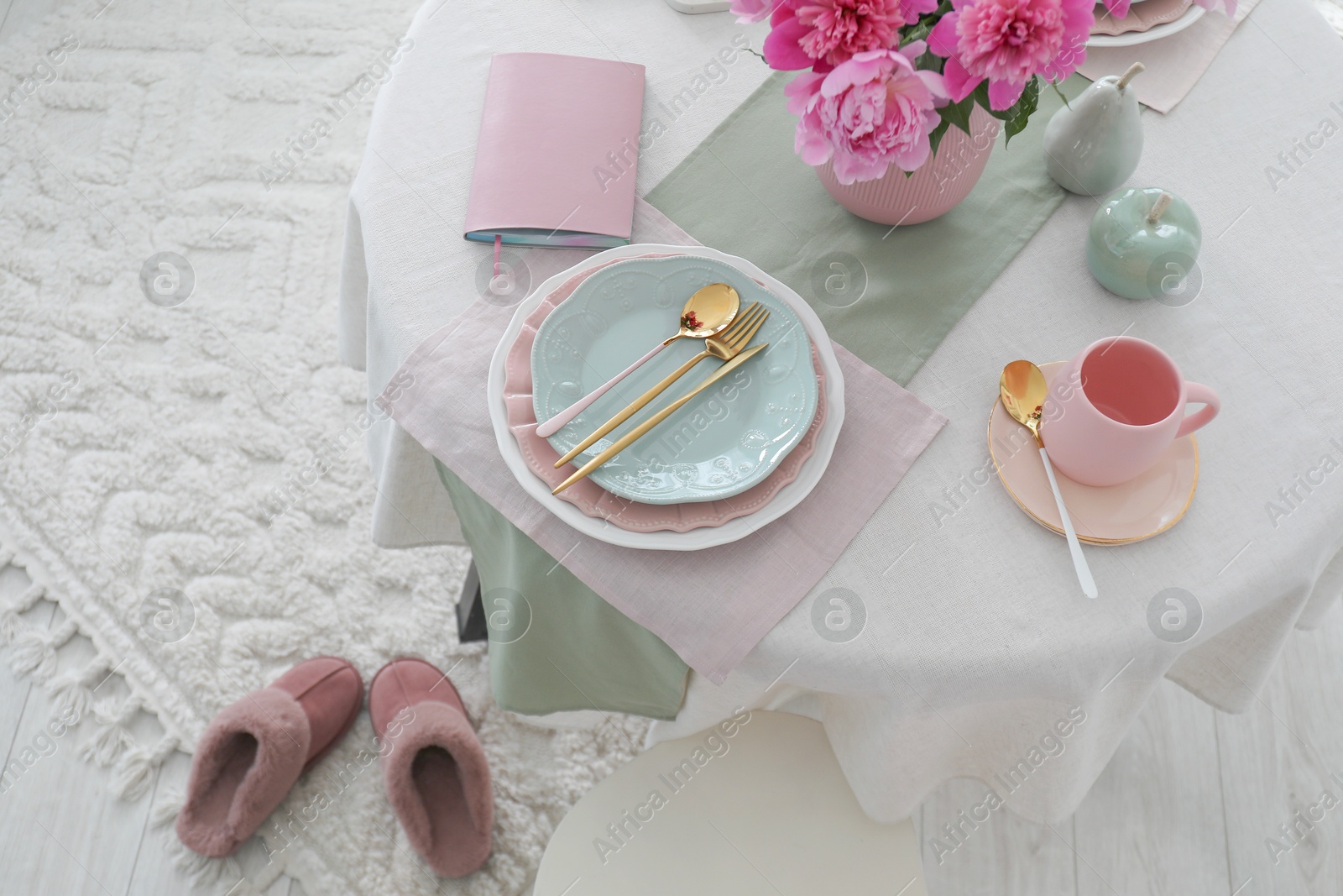 Photo of Beautiful table setting with pink accent indoors, top view