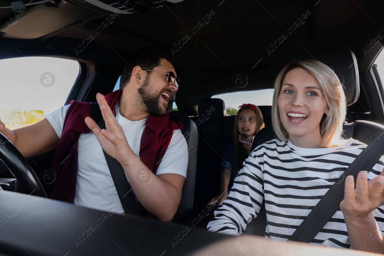 Photo of Happy family singing in car, view from inside