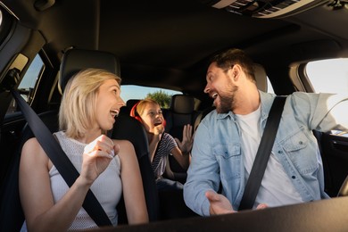 Photo of Happy family singing in car, view from inside