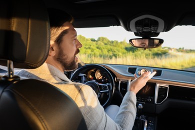 Man singing in car, view from inside