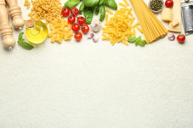 Photo of Different types of pasta, grater, spices and products on light table, flat lay. Space for text