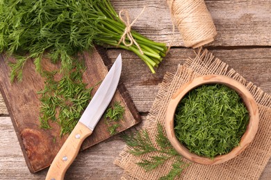 Photo of Flat lay composition with fresh dill on wooden table