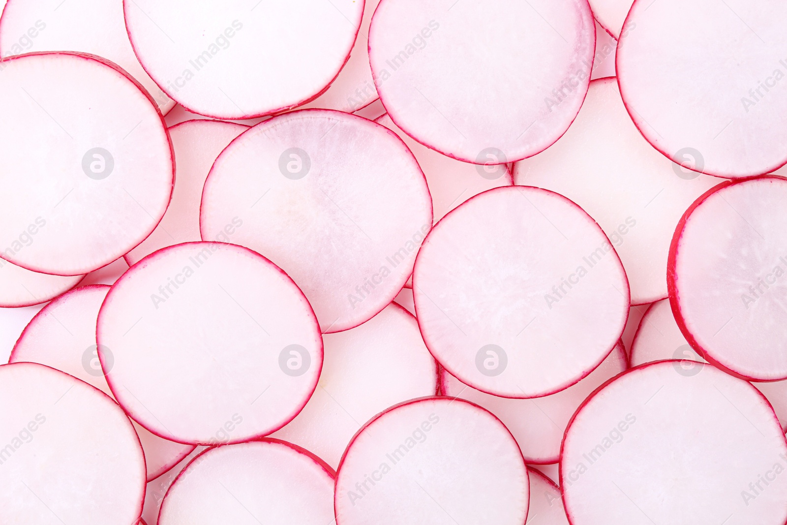 Photo of Slices of fresh ripe radish as background, top view