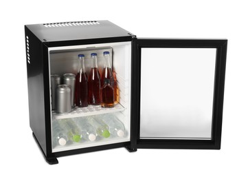 Photo of Mini refrigerator with drinks isolated on white