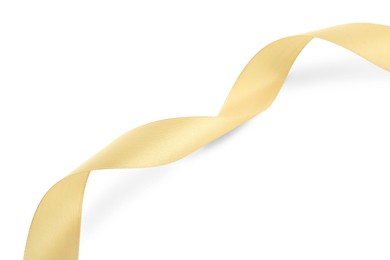Photo of One beautiful light yellow ribbon isolated on white, top view
