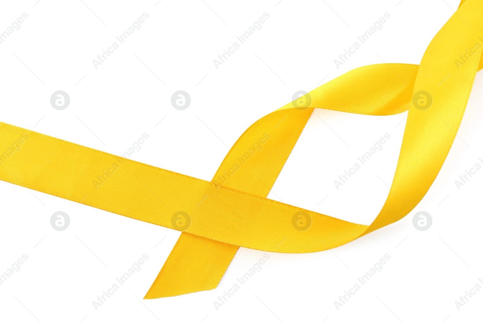 Photo of One beautiful yellow ribbon isolated on white, top view