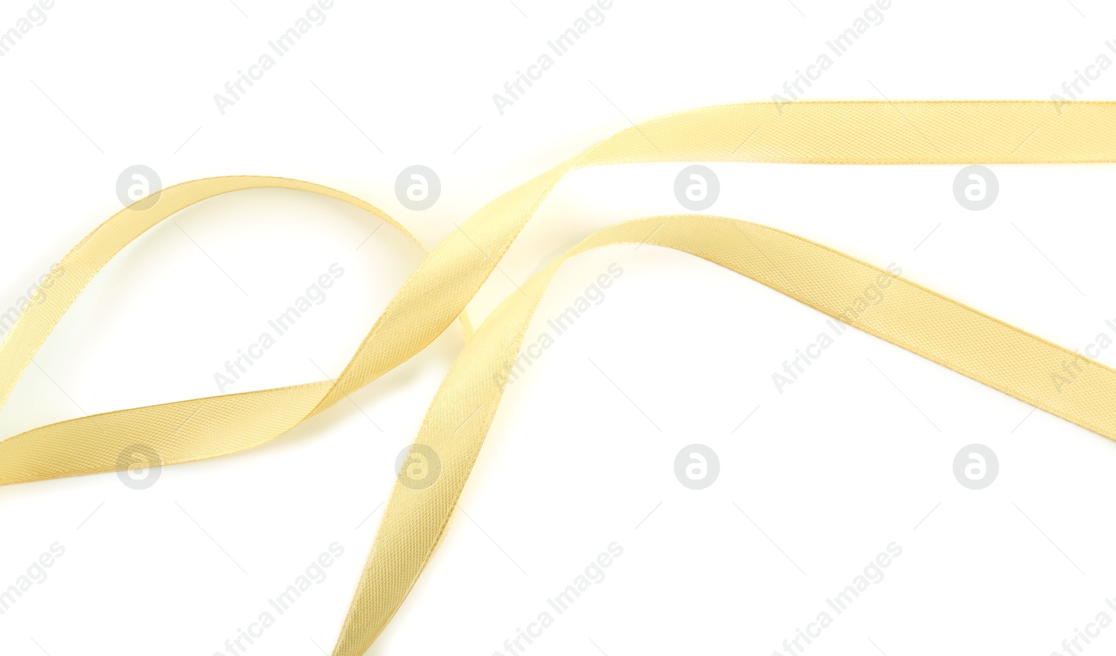 Photo of One beautiful light yellow ribbon isolated on white, top view