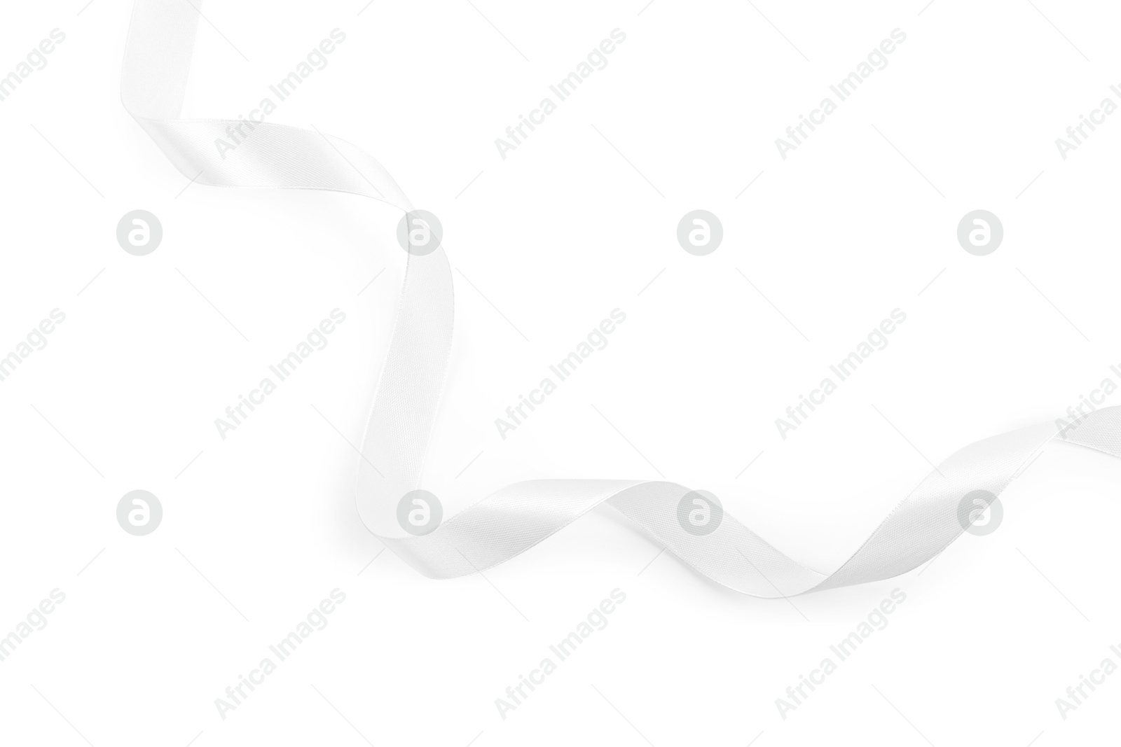 Photo of One beautiful silk ribbon isolated on white, top view