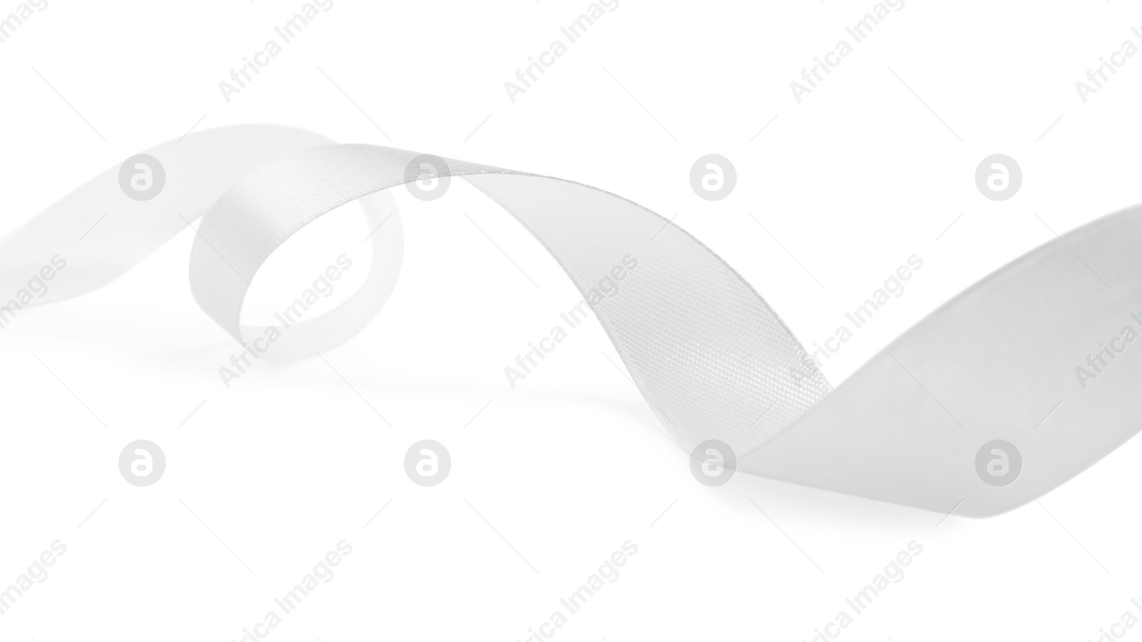 Photo of One beautiful silk ribbon isolated on white