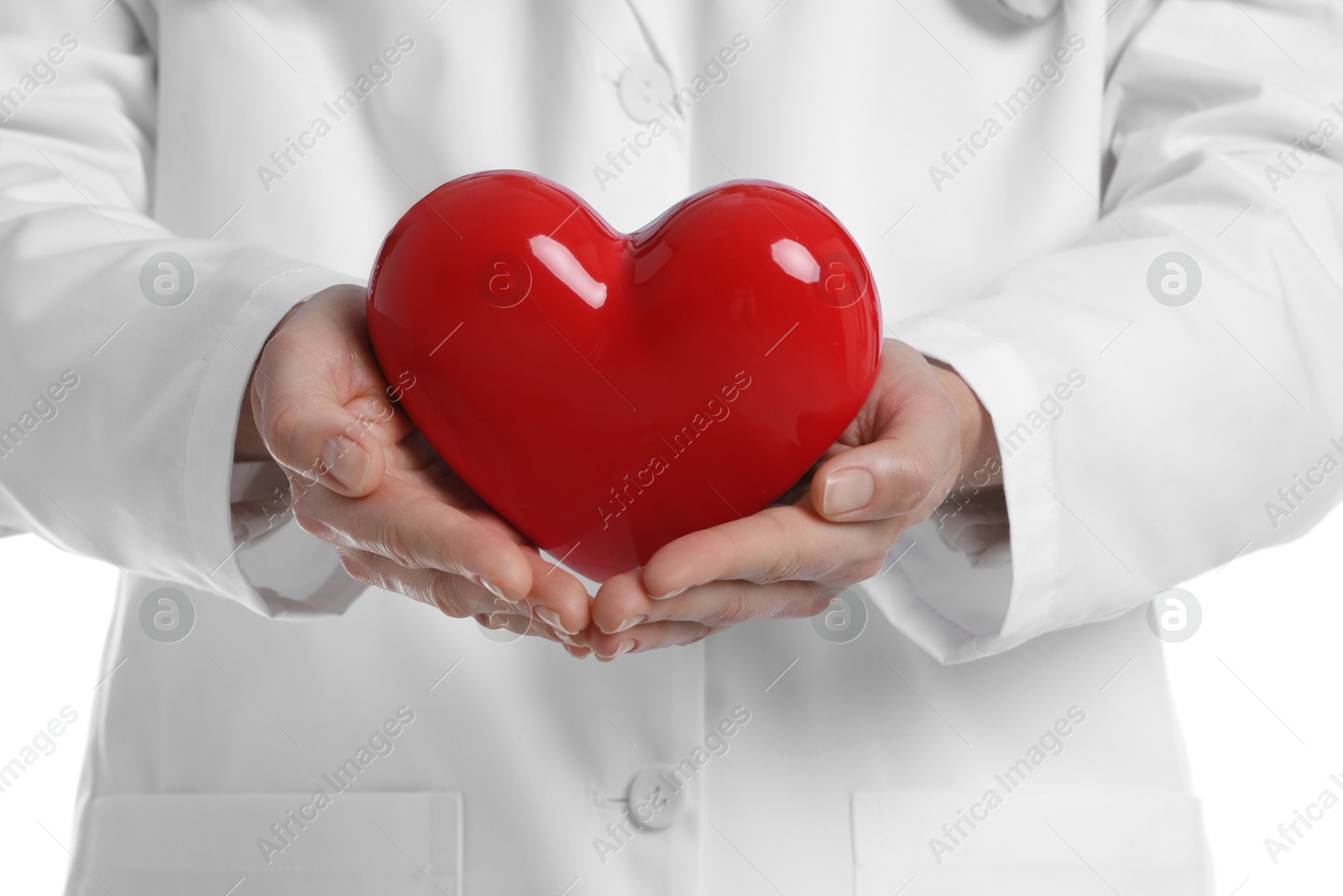 Photo of Doctor with red heart on white background, closeup