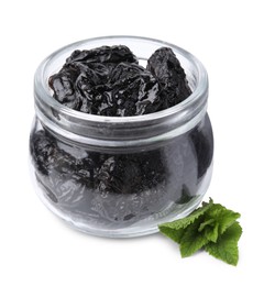 Photo of Tasty dried plums (prunes) in glass jar and mint leaves on white background