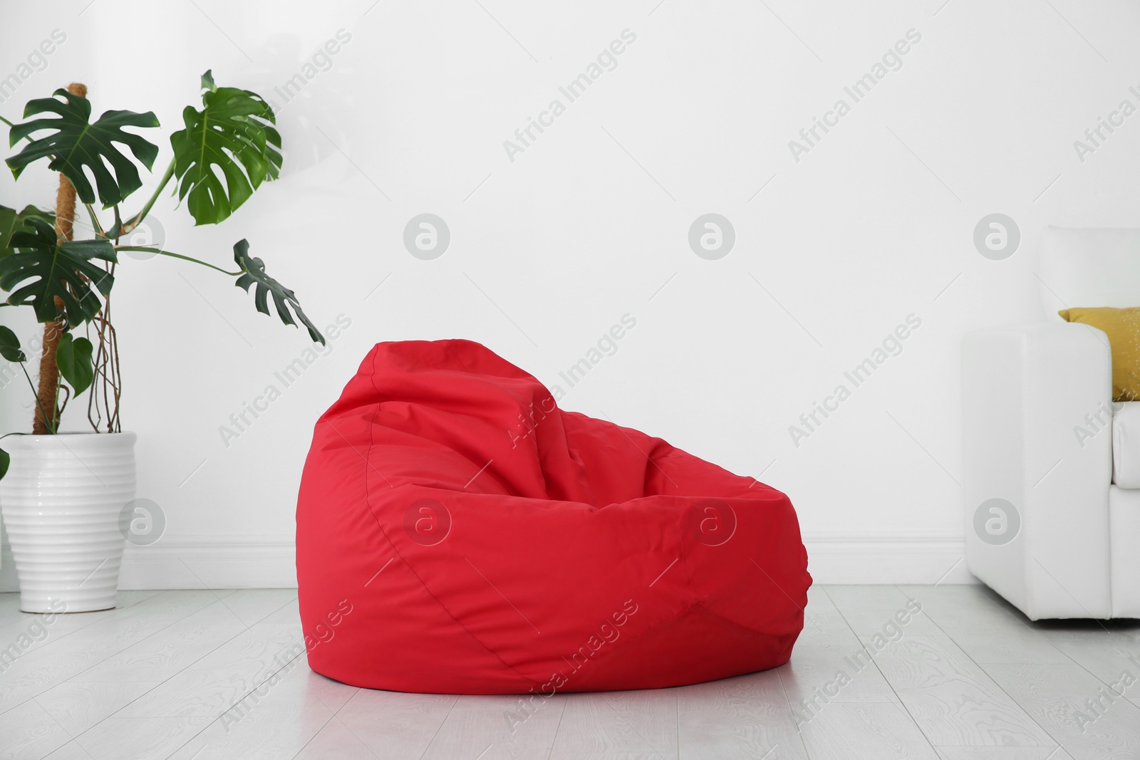 Photo of Red bean bag chair on floor in room