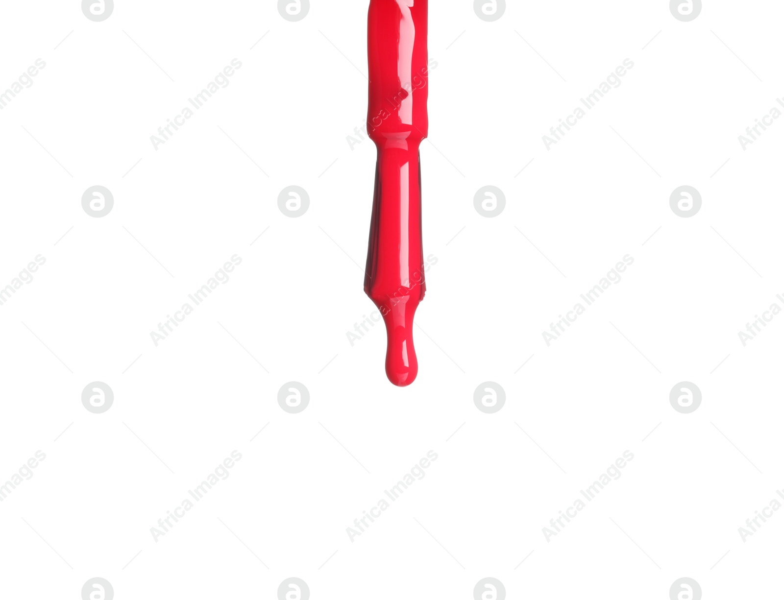 Photo of Red nail polish dripping from brush isolated on white