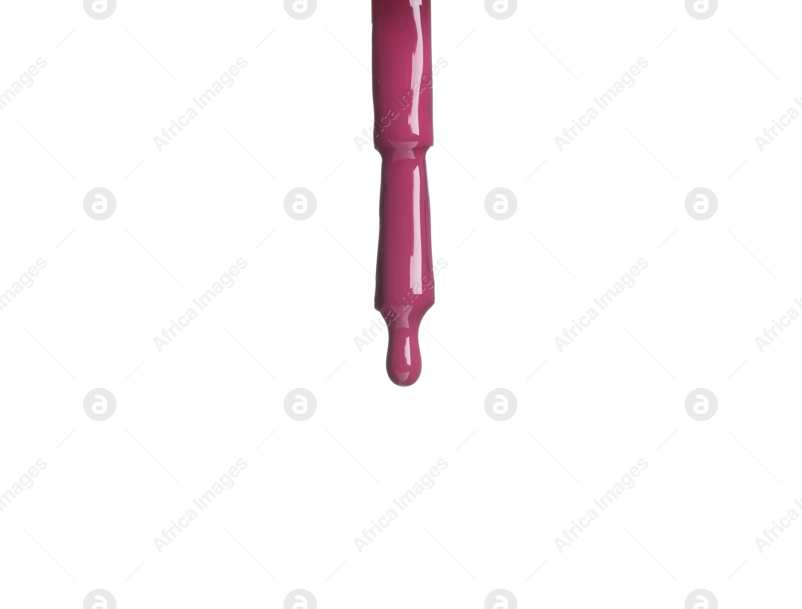 Photo of Purple nail polish dripping from brush isolated on white