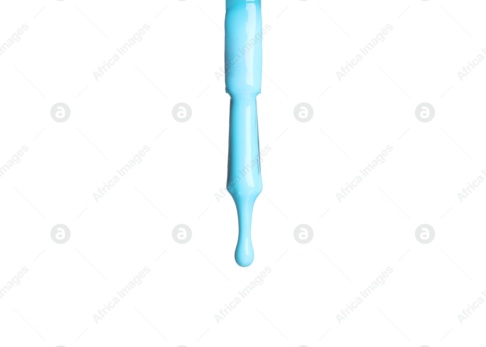 Photo of Light blue nail polish dripping from brush isolated on white