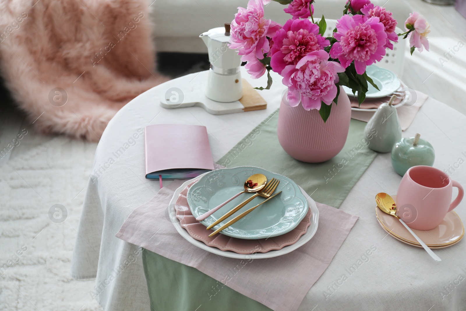 Photo of Beautiful table setting with pink peonies in dining room