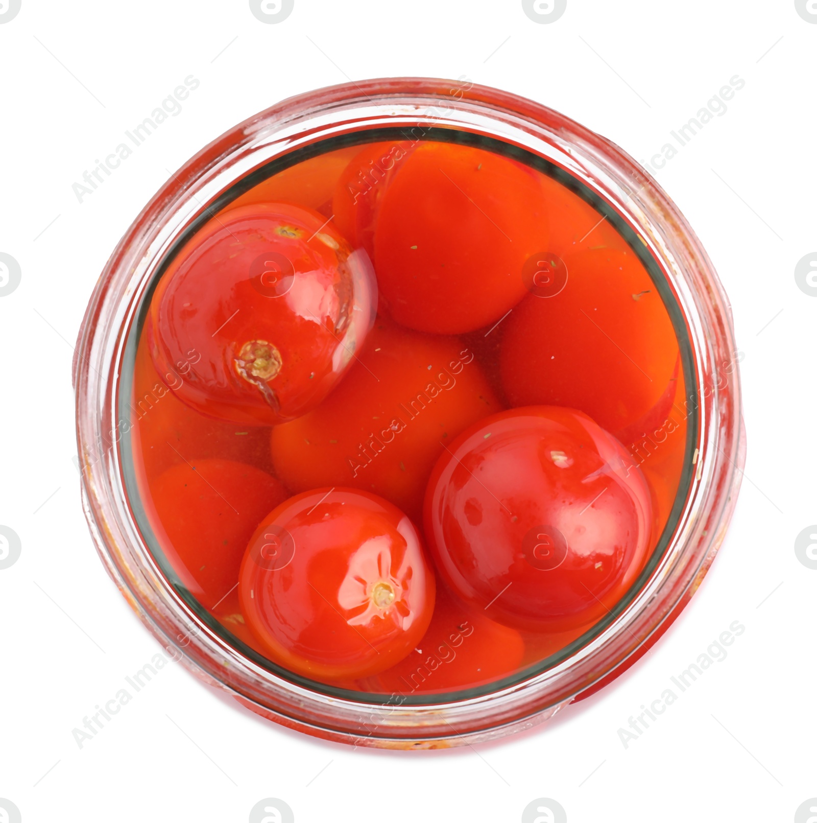 Photo of Tasty pickled tomatoes in jar isolated on white, top view